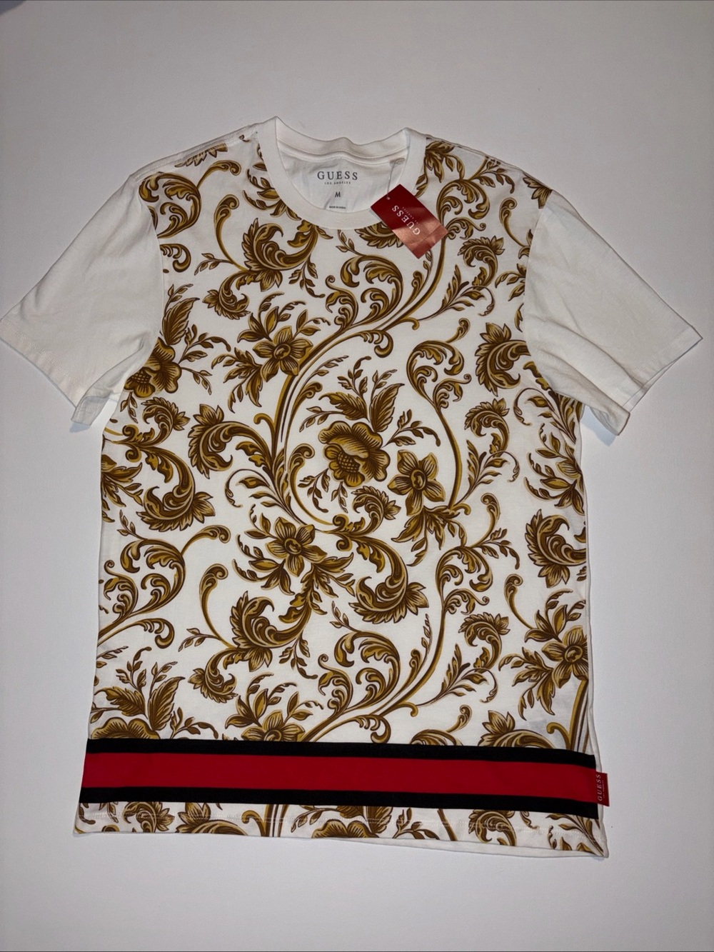 GUESS White T-Shirt with Gold Baroque Print and Red-Black Hem Stripe M
